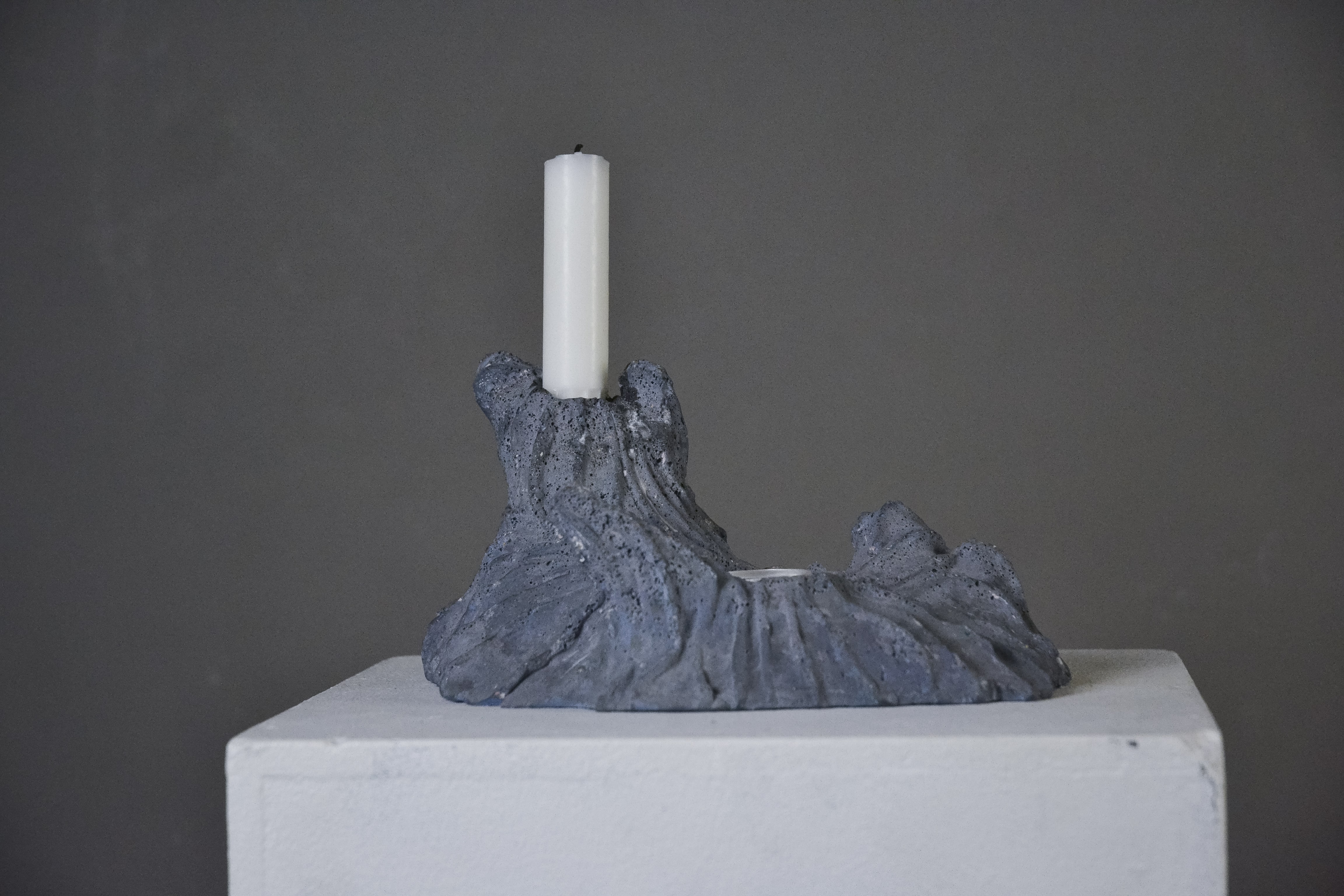 a volcano inspired, grey candle holder